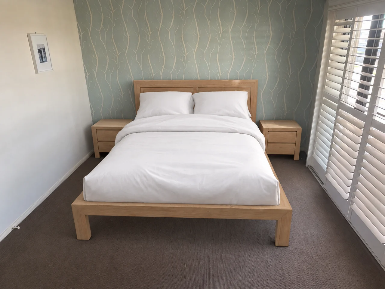 The same bedroom with a new oak bed frame and two oak bedside tables, placed at their real size.