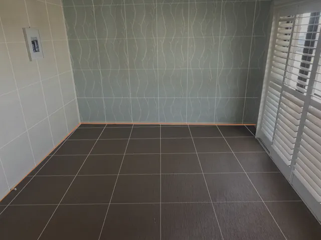 The cleared room with the measured floor drawn as a half-metre grid and the walls outlined.